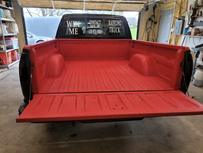 Custom red spray-in bed liner Elite Garage Elburn IL